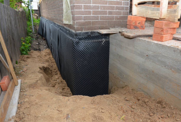 SJ Waterproofing Pros technician performing targeted Waterproofing assessment in Midland, VA